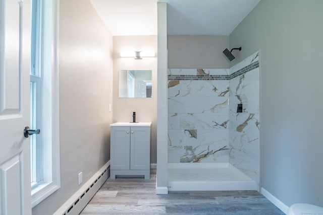 63 Rose Haven Rd, Somers, CT 06071 - bathroom featuring vanity, a marble finish shower, wood finished floors, and a baseboard heating unit