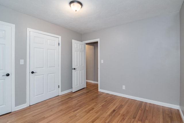 63 Rose Haven Rd, Somers, CT 06071 - unfurnished bedroom featuring baseboards and light wood-type flooring