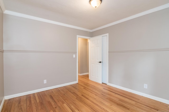 63 Rose Haven Rd, Somers, CT 06071 - unfurnished bedroom with light wood-style floors, ornamental molding, and a closet