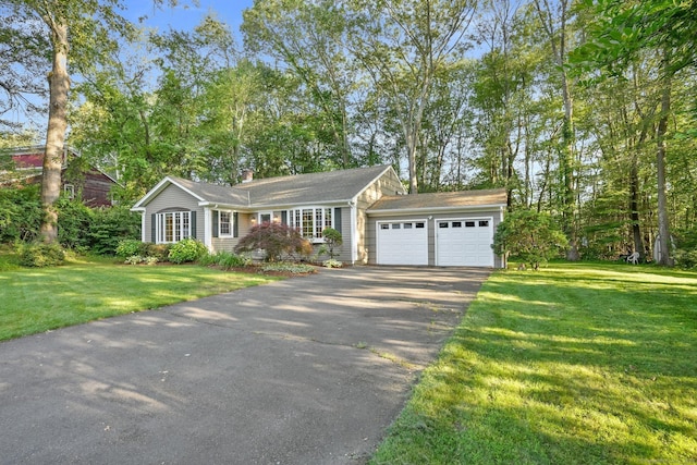 41 White Birch Dr, Trumbull, CT 06611 - view of front of home featuring asphalt driveway, a front yard, an attached garage, and a chimney