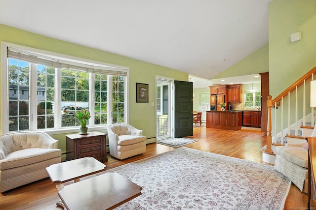 41 White Birch Dr, Trumbull, CT 06611 - living area featuring a baseboard radiator, light wood-style flooring, stairway, and vaulted ceiling