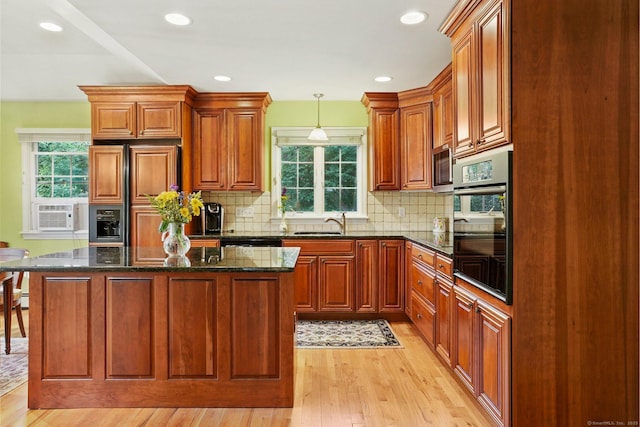 41 White Birch Dr, Trumbull, CT 06611 - kitchen with oven, light wood-style floors, paneled built in refrigerator, a center island, and tasteful backsplash