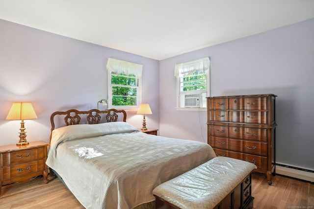 41 White Birch Dr, Trumbull, CT 06611 - bedroom with light wood finished floors, a baseboard radiator, and cooling unit