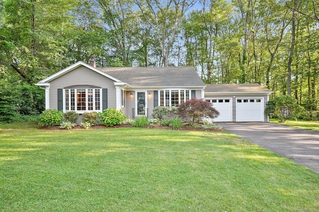 41 White Birch Dr, Trumbull, CT 06611 - view of front of home featuring a chimney, asphalt driveway, a front lawn, and a shingled roof