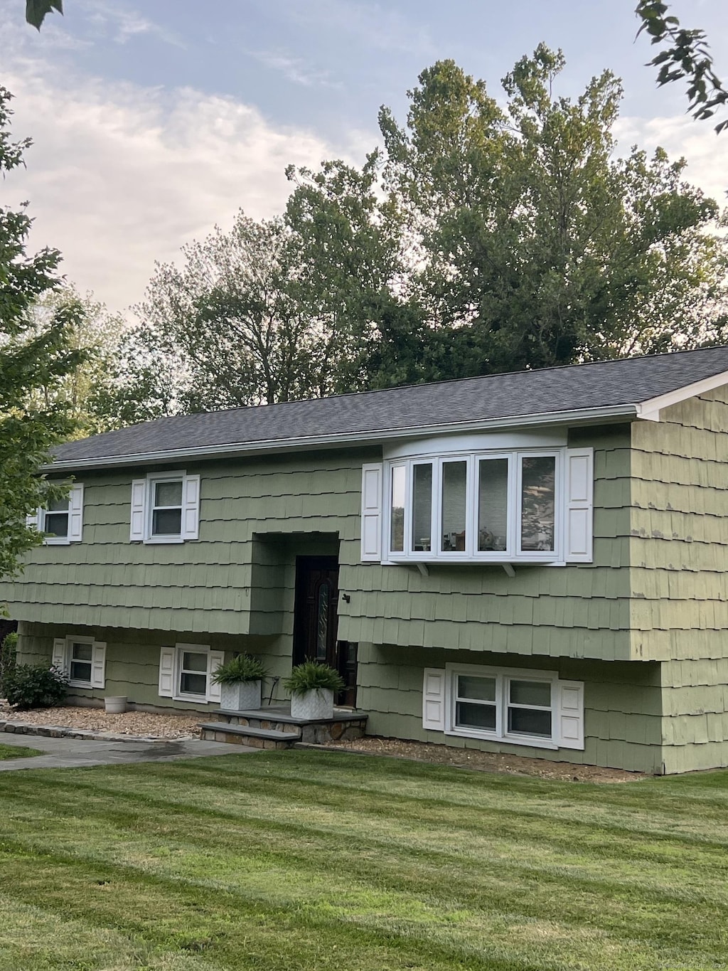 8 Del View Dr, Danbury, CT 06811 - raised ranch with a front lawn and roof with shingles