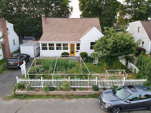 41 Baxter Dr, Norwalk, CT 06854 - view of front of house featuring a chimney and a shingled roof