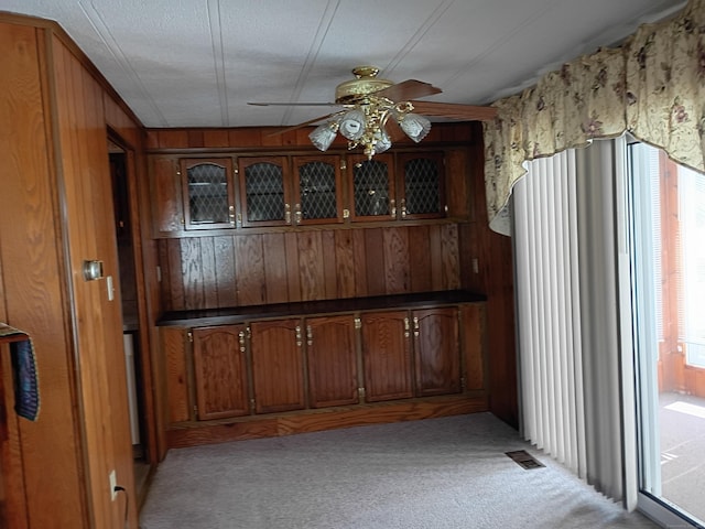 65 Woodland Park, Shelton, CT 06484 - bar area with light colored carpet, ceiling fan, and wood walls