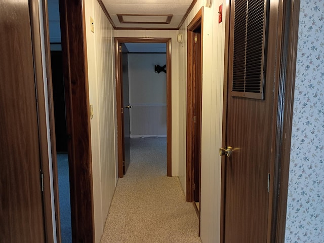 65 Woodland Park, Shelton, CT 06484 - hallway featuring wallpapered walls, light colored carpet, and attic access