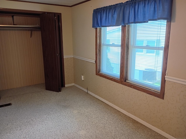 65 Woodland Park, Shelton, CT 06484 - unfurnished bedroom featuring multiple windows, a closet, and carpet