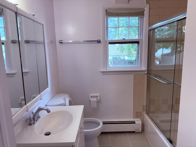 49 Soundview Ave Unit 49, Stamford, CT 06606 - full bathroom featuring a baseboard radiator, plenty of natural light, enclosed tub / shower combo, and vanity