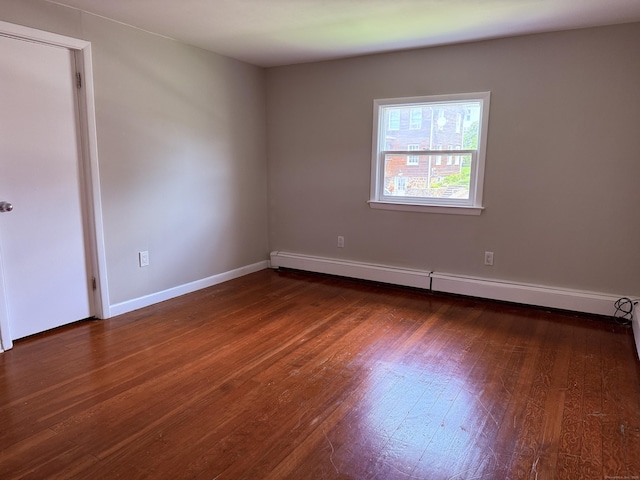 49 Soundview Ave Unit 49, Stamford, CT 06606 - unfurnished room featuring baseboard heating and dark wood finished floors