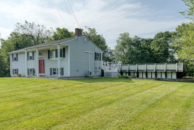 28 Clementel Dr, Durham, CT 06422 - back of house with a chimney, a lawn, and a deck