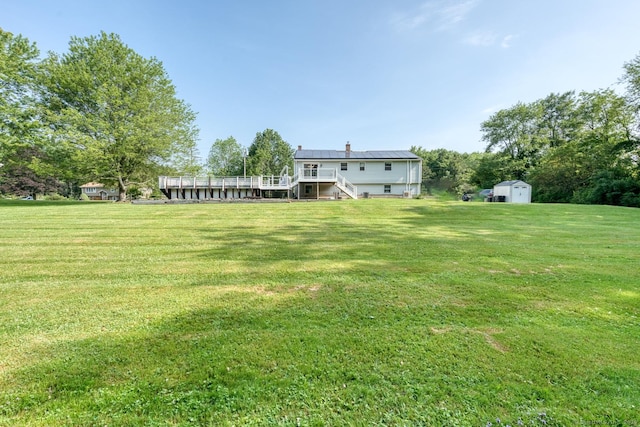 28 Clementel Dr, Durham, CT 06422 - view of green lawn with a shed, stairs, and a wooden deck