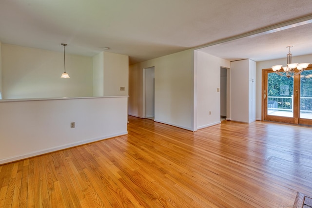 28 Clementel Dr, Durham, CT 06422 - unfurnished room featuring light wood-type flooring and a chandelier