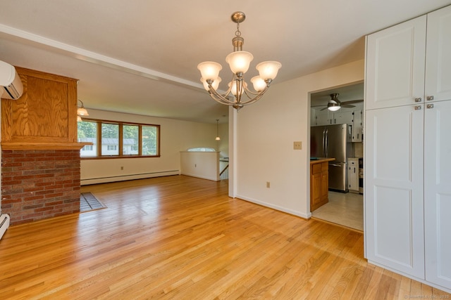 28 Clementel Dr, Durham, CT 06422 - unfurnished dining area featuring baseboard heating, light wood-style flooring, a chandelier, and ceiling fan