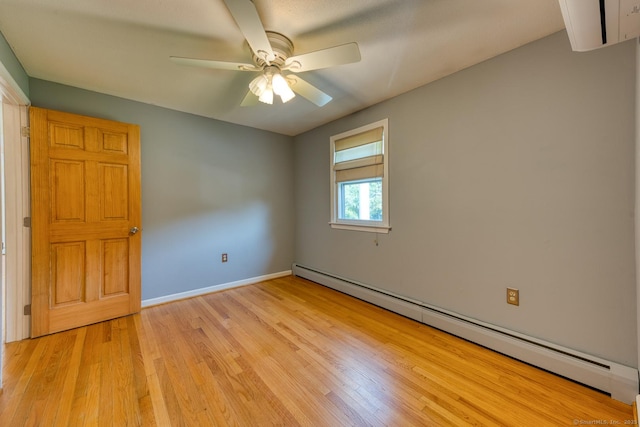 28 Clementel Dr, Durham, CT 06422 - spare room featuring a baseboard heating unit, light wood-style floors, and a ceiling fan