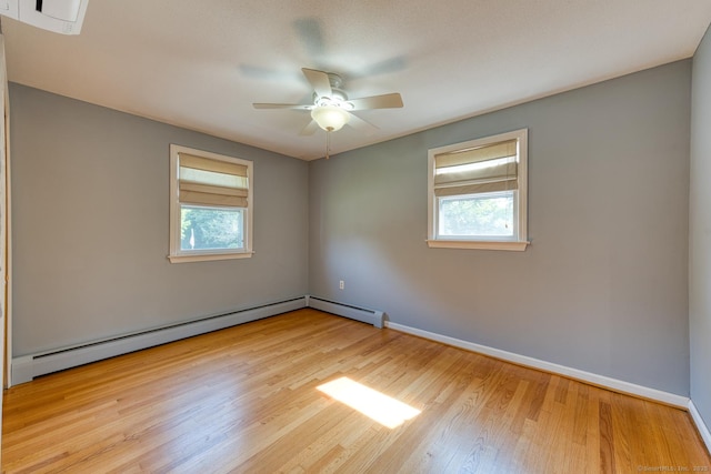 28 Clementel Dr, Durham, CT 06422 - empty room with plenty of natural light, wood finished floors, baseboard heating, and a ceiling fan