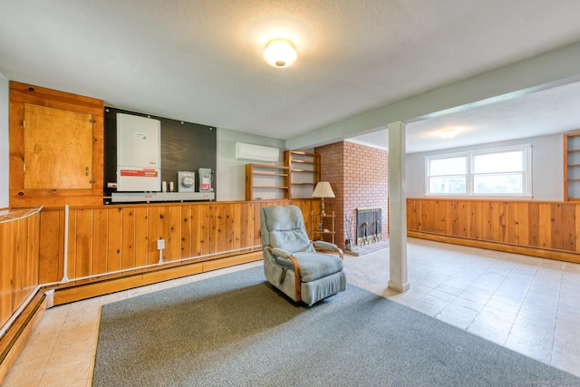 28 Clementel Dr, Durham, CT 06422 - living area with wood walls, a wall mounted AC, a baseboard radiator, wainscoting, and a fireplace