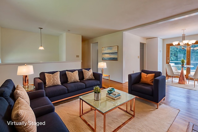 28 Clementel Dr, Durham, CT 06422 - living area with a chandelier and wood finished floors