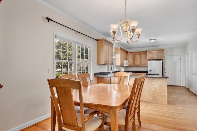 71 Lavender Ln Unit 71, South Windsor, CT 06074 - dining area with ornamental molding, a chandelier, and light wood-type flooring
