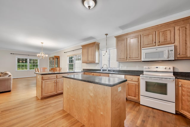 71 Lavender Ln Unit 71, South Windsor, CT 06074 - kitchen featuring white appliances, crown molding, a center island, light wood-style floors, and a chandelier