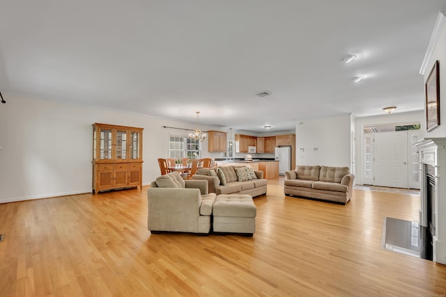 71 Lavender Ln Unit 71, South Windsor, CT 06074 - living area featuring light wood-style flooring and a chandelier