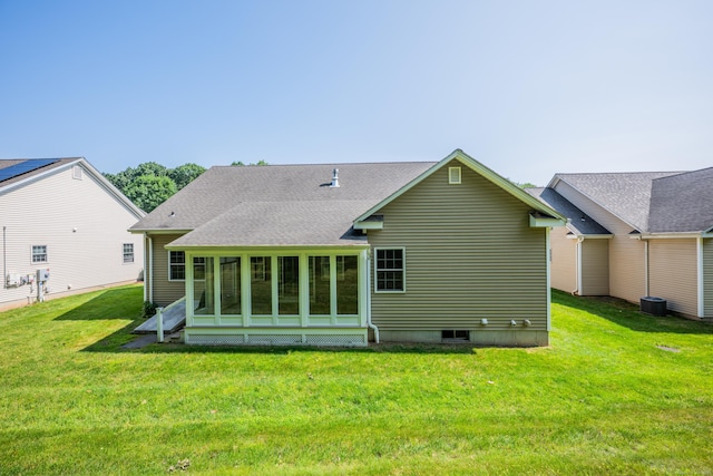 71 Lavender Ln Unit 71, South Windsor, CT 06074 - back of property with a yard, a shingled roof, and a sunroom