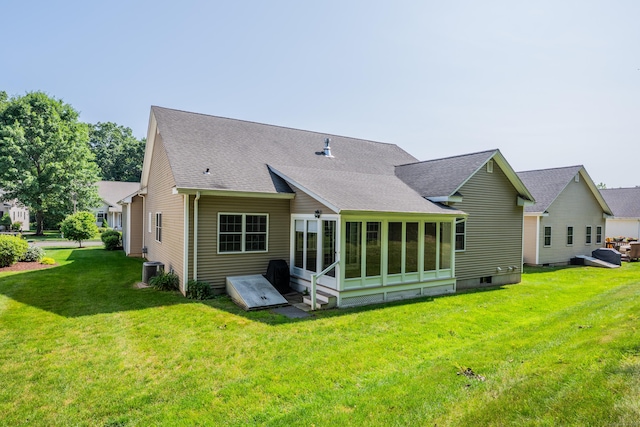 71 Lavender Ln Unit 71, South Windsor, CT 06074 - back of property with a shingled roof, a lawn, and a sunroom