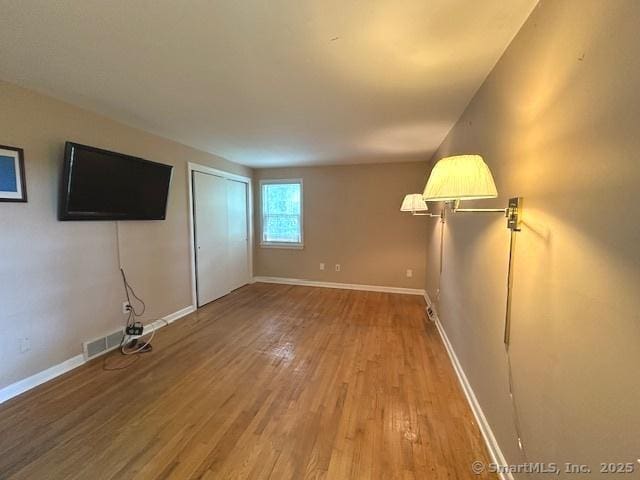 15 Bargate Rd, Clinton, CT 06413 - unfurnished living room featuring light wood-style flooring and baseboards