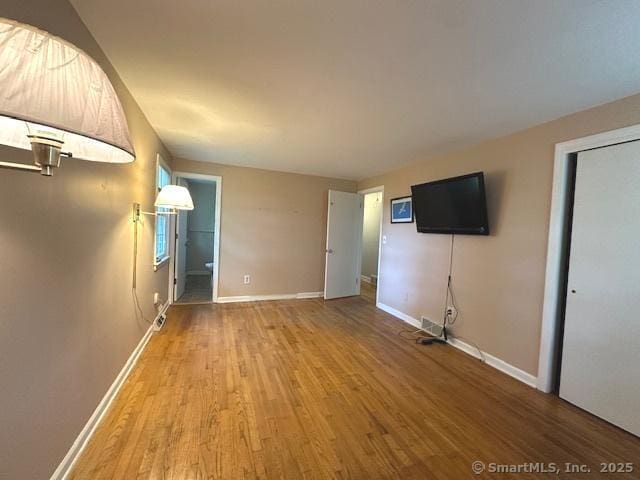 15 Bargate Rd, Clinton, CT 06413 - unfurnished living room featuring wood finished floors and baseboards