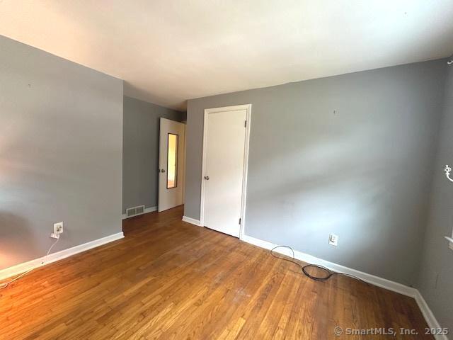 15 Bargate Rd, Clinton, CT 06413 - unfurnished room featuring baseboards and wood finished floors
