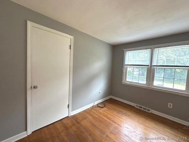 15 Bargate Rd, Clinton, CT 06413 - empty room with wood finished floors and baseboards