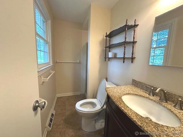 15 Bargate Rd, Clinton, CT 06413 - full bathroom with vanity, tile patterned floors, and a shower