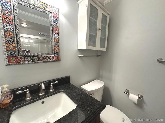 15 Bargate Rd, Clinton, CT 06413 - full bathroom with an enclosed shower, vanity, and ornamental molding
