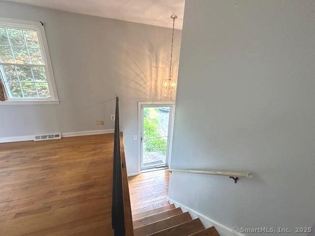 15 Bargate Rd, Clinton, CT 06413 - stairs with wood finished floors, plenty of natural light, and a chandelier