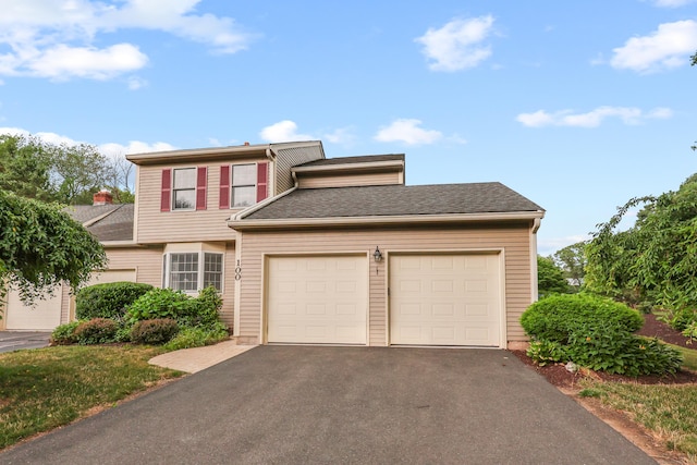 100 Chandler, Windsor, CT 06095 - view of front of home featuring a garage, asphalt driveway, and roof with shingles