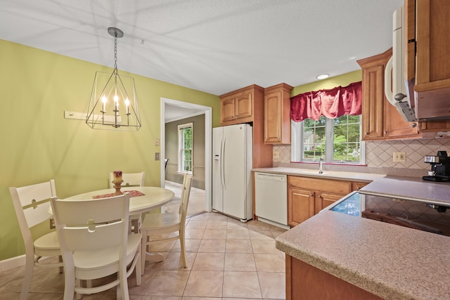 100 Chandler, Windsor, CT 06095 - kitchen with white appliances, backsplash, and plenty of natural light