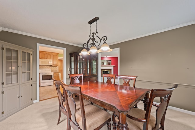 100 Chandler, Windsor, CT 06095 - dining room with a glass covered fireplace, crown molding, and light colored carpet