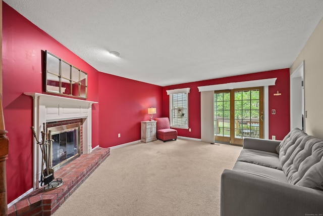 100 Chandler, Windsor, CT 06095 - carpeted living area with a textured ceiling and a fireplace