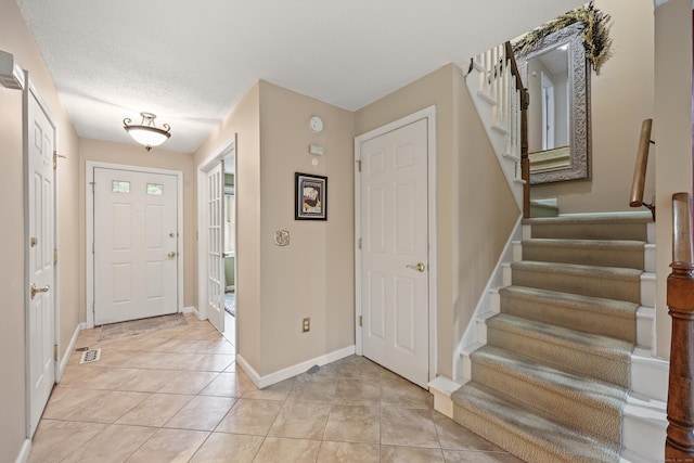 100 Chandler, Windsor, CT 06095 - entryway with stairway and light tile patterned floors