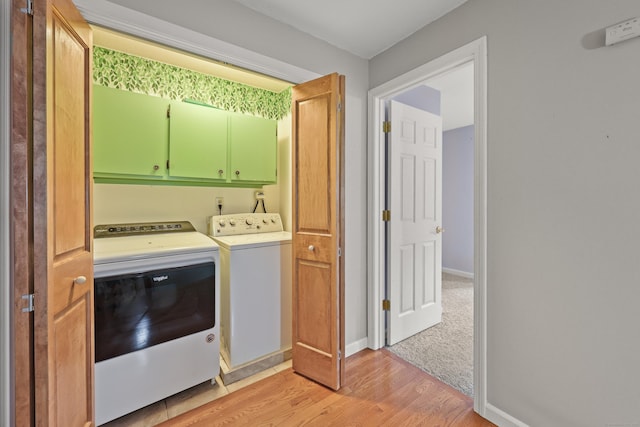 100 Chandler, Windsor, CT 06095 - laundry area featuring washing machine and dryer, light wood-style floors, and cabinet space