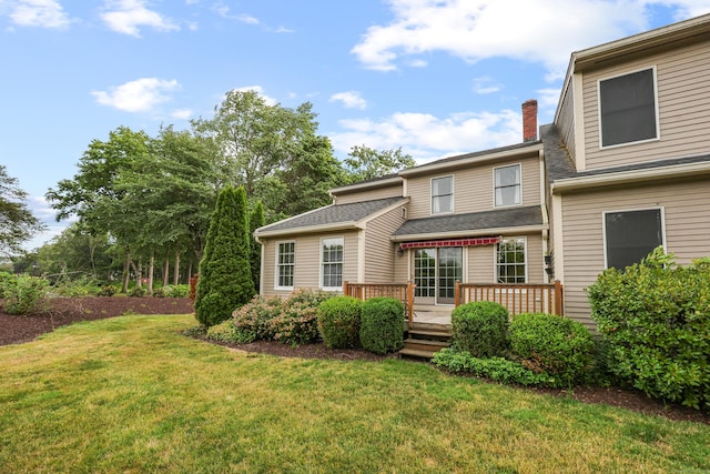100 Chandler, Windsor, CT 06095 - view of front of home with a front lawn, a deck, and a chimney