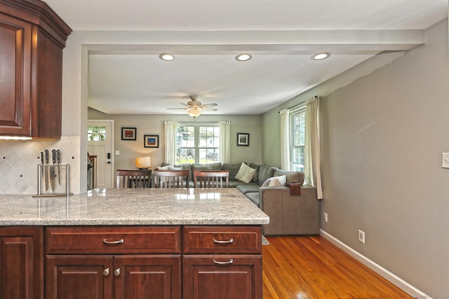 30 Wilcox Rd, Milford, CT 06460 - kitchen with a peninsula, dark wood-style floors, ceiling fan, tasteful backsplash, and recessed lighting