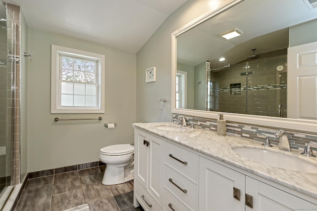 30 Wilcox Rd, Milford, CT 06460 - full bath with double vanity, a shower stall, lofted ceiling, decorative backsplash, and tile patterned floors