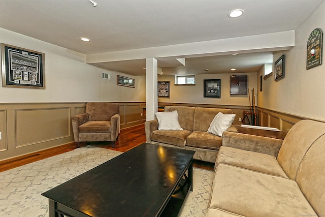 30 Wilcox Rd, Milford, CT 06460 - living area featuring wood finished floors, a wainscoted wall, and recessed lighting