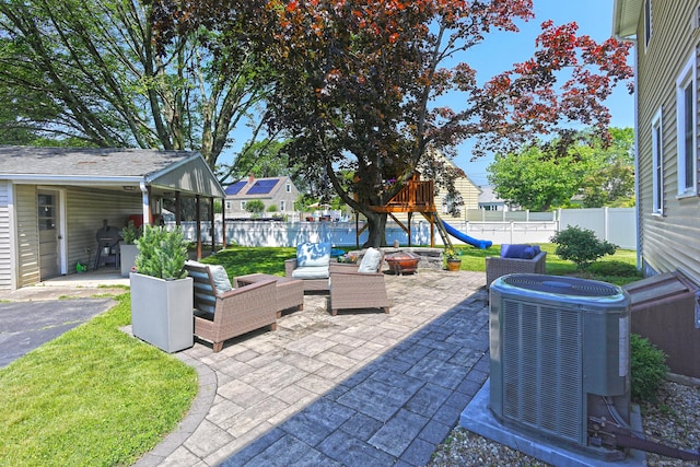 30 Wilcox Rd, Milford, CT 06460 - fenced backyard featuring a playground, a patio area, and an outdoor living space