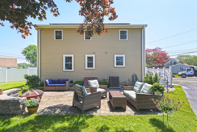 30 Wilcox Rd, Milford, CT 06460 - rear view of house featuring an outdoor living space with a fire pit and a patio area
