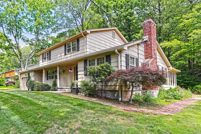 55 Gate Way, Hamden, CT 06518 - view of front of home with a garage, a front lawn, and a chimney