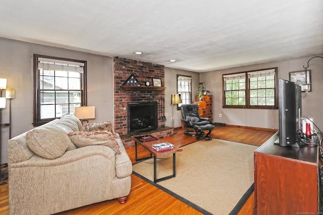 55 Gate Way, Hamden, CT 06518 - living area with wood finished floors, a fireplace, and recessed lighting