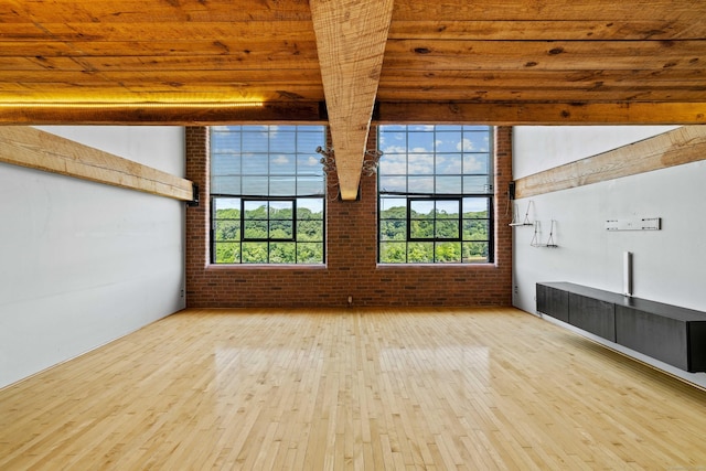 68 Thermos Ave Unit 302D, Norwich, CT 06360 - empty room with hardwood / wood-style floors, brick wall, and wood ceiling